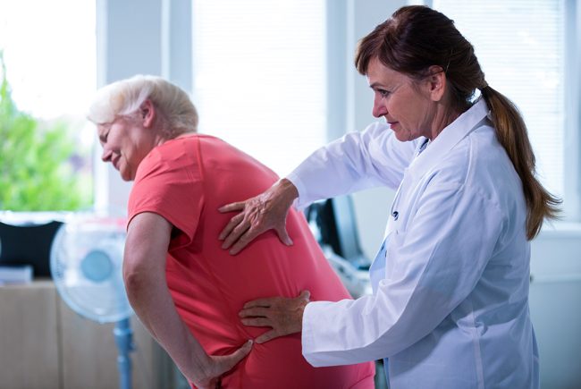 Female doctor examining a patient at the hospital